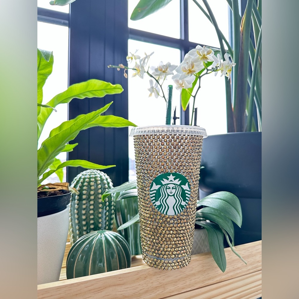 Bling gold rhinestone reusable cup tumbler with lid and straw.